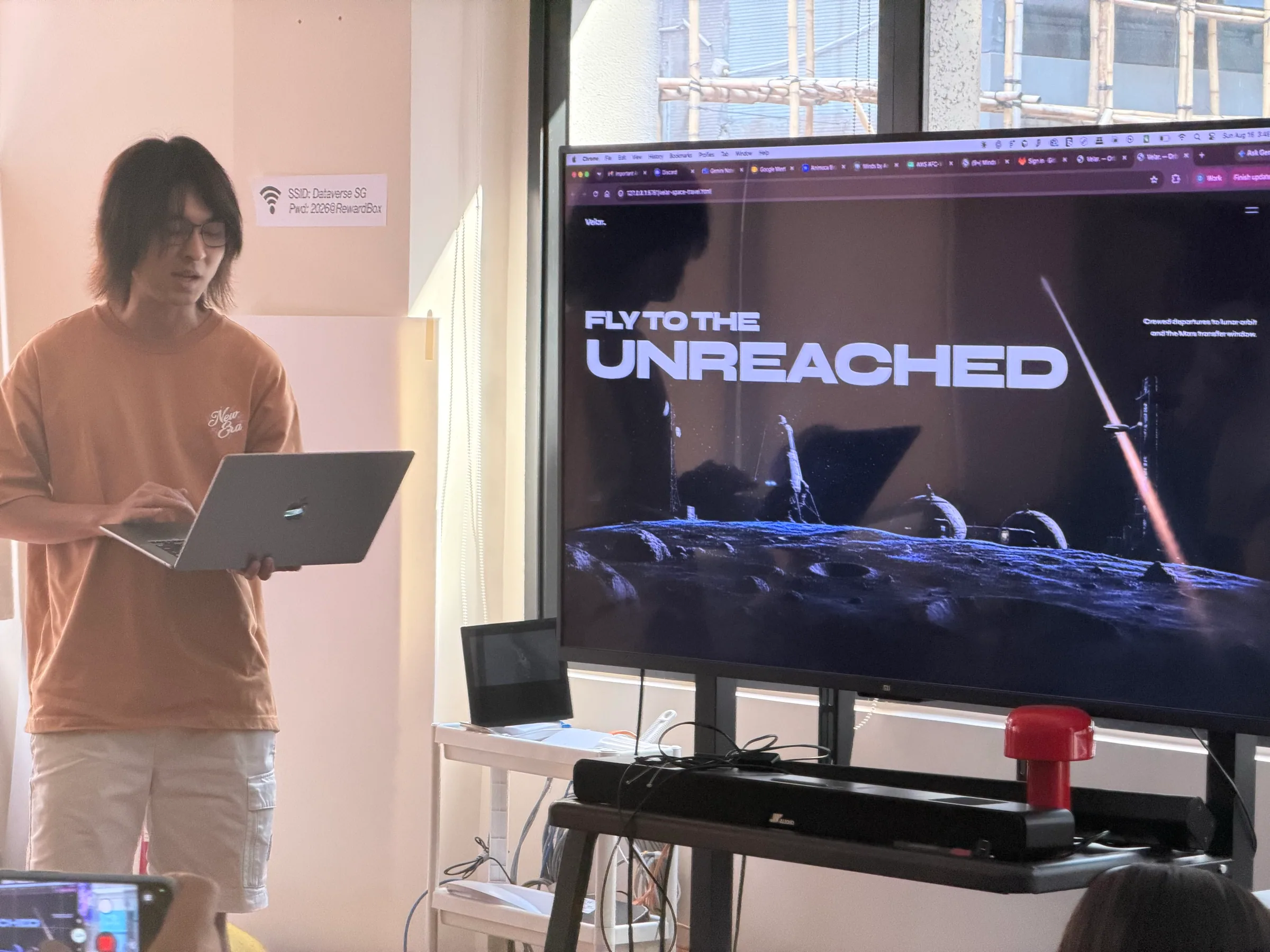 A participant showing an expressive web experience at the Hong Kong workshop